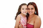 Young Latin Mother Hugging Her Daughter Isolated On A White Back Stock Photo