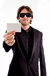 Young Male Holding Business Card Stock Photo
