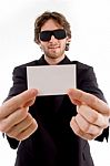 Young Male Holding Business Card Stock Photo