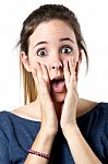 Young Surprised Woman Holding Her Face Stock Photo