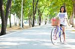 Young Woman Bicycling Stock Photo