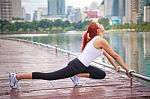 Young Woman Doing Stretching Exercise Stock Photo