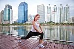 Young Woman Doing Stretching Exercise Stock Photo