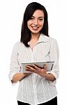 Young Woman Holding Digital Tablet Stock Photo