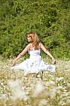 young Woman In Meadow Stock Photo