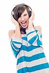 Young Woman Listening To Loud Music Stock Photo