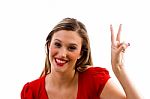 Young Woman Showing Winning Gesture Stock Photo