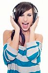 Young Woman Singing In Headphones Stock Photo