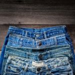 Blue Jean And Jean Lack Texture On The Wooden Floor Stock Photo