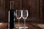 Bottle Of Red Wine And Two Empty Glasses Stock Photo