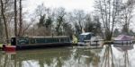 Narrow Boat And Other Boats On The River Wey Navigations Canal Stock Photo