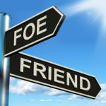 Foe Friend Signpost Means Enemy Or Ally Stock Photo