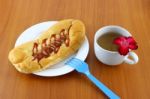 Sausage Salad Cream And Ketchup Bread With Tea On Table Stock Photo