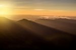 Beautiful Sun Rise On Top Mountain With Sun Ray Warm Tone Stock Photo