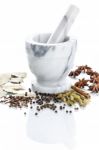Marble Mortar And Pestle With Assorted Spices On White Backgroun Stock Photo