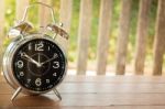 Alarm Clock On Wooden Background Stock Photo