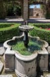 View Of The Fountain In The Alcazaba Fort And Palace Gardens In Stock Photo