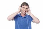 Young Guy Listening To Music Stock Photo