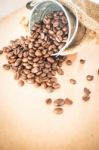 Coffee Roasted Bean In The Bucket On Wooden Background Stock Photo
