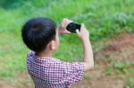 Little Boy Taking Photos By Digital Camera On Smartphone With Go Stock Photo