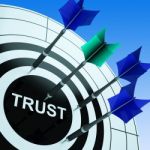 Trust On Dartboard Shows Reliability Stock Photo