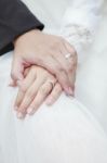 Hand Of Groom And Bride Warming Holding With Wedding Daimond Ring Stock Photo