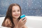 Little Smiling Girl Holding Soap Stock Photo