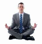 Businessman Meditating Stock Photo