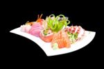 Mixed Sashimi In White Plate Isolated On Black Background,with C Stock Photo