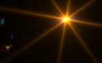 Abstract Lens Flare Light Over Black Background Stock Photo