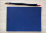 Chinese Writing Brush With Blue Notebook Stock Photo