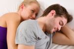 Couple Lying In Bed Stock Photo