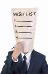 Businessman With Wish List Head Stock Photo