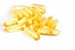 Pile Of Shiny Yellow Vitamin Capsules Stock Photo