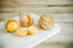 Physalis, Or Cape Gooseberry Fruit Over Old Wood Background Stock Photo