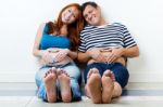 Young Couple Expecting Baby. Isolated On White Stock Photo