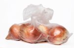 View Of Some Onions Inside A Plastic Bag Stock Photo