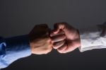 Fist Bump Handshake Between Businessmen Stock Photo