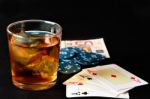 Poker, Whisky And Money Stock Photo