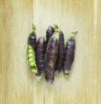 View Of Fresh Violet Pea Pods And Peas Stock Photo