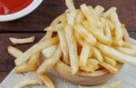 French Fries On Table Stock Photo