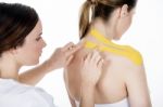 Physiotherapist Gets Taping On The Trapezius Stock Photo