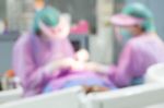 Dentist And Dental Assistants In Hospital ( Blurry Dental Background ) Stock Photo