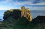 Dunnottar Castle With Blue Sky Background Stock Photo