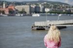 Lady Looking At The River Danube In Budapest Stock Photo