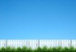 White Fence And Blue Sky Stock Photo