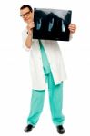 Male Doctor holding X Ray Stock Photo