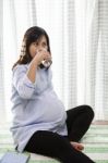 Asian Woman Pregnant ,pregnancy Drinking Fresh Water In Glass Us Stock Photo