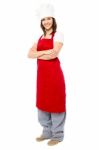 Lady Chef Wearing Apron, Full Length Shot Stock Photo