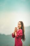 Beautiful Young Attractive  Asian Women In Red Dress On Sunrise Beautiful Nature Background Of The Mountains And Lotus Garden Image Of Happy  Camping, Travel, Lifestyle Resting , Relaxing Concept Vintage Style Stock Photo